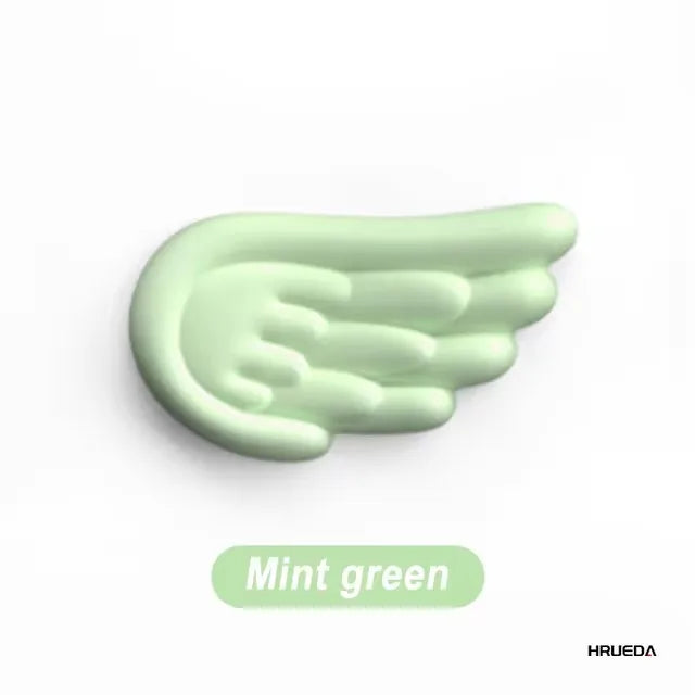 Apoio de pulso para teclado e mouse em formato de asa de anjo, feito de espuma viscoelástica. Suporte ergonômico e antiderrapante para digitação fácil em computadores e laptops.