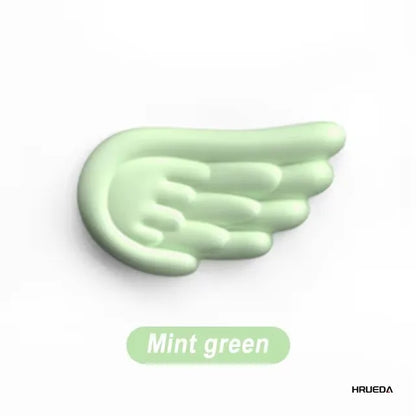 Apoio de pulso para teclado e mouse em formato de asa de anjo, feito de espuma viscoelástica. Suporte ergonômico e antiderrapante para digitação fácil em computadores e laptops.