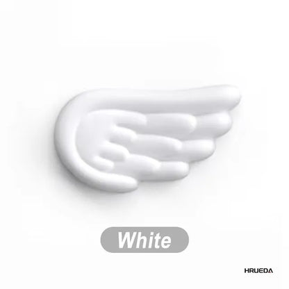 Apoio de pulso para teclado e mouse em formato de asa de anjo, feito de espuma viscoelástica. Suporte ergonômico e antiderrapante para digitação fácil em computadores e laptops.